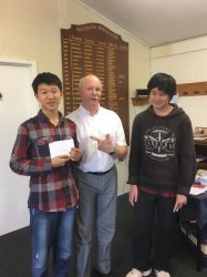 William Han and Eddy Tan receive their prizes from Waitemata Club Treasurer, Geoff Sidon. 